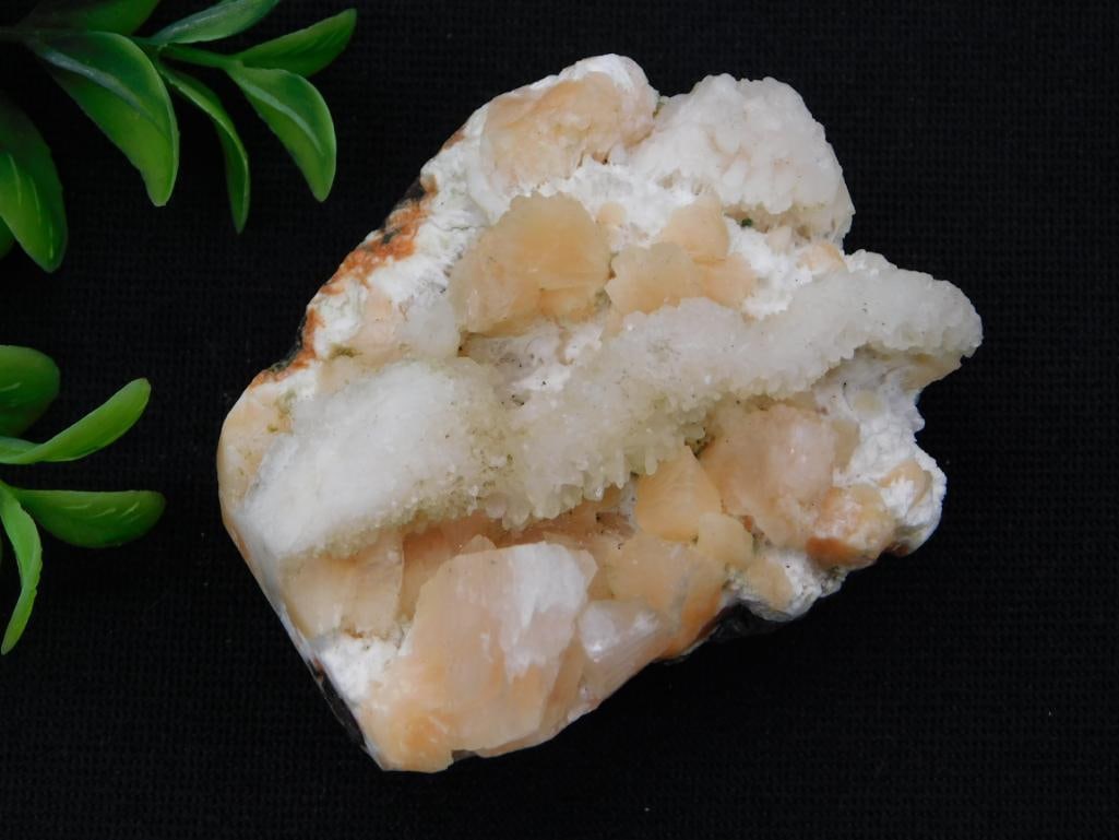 Natural Calcite Crystal Cluster Specimen: A cream and peach-colored calcite crystal cluster specimen with rhombohedral formations on a matrix base. 82 grams.