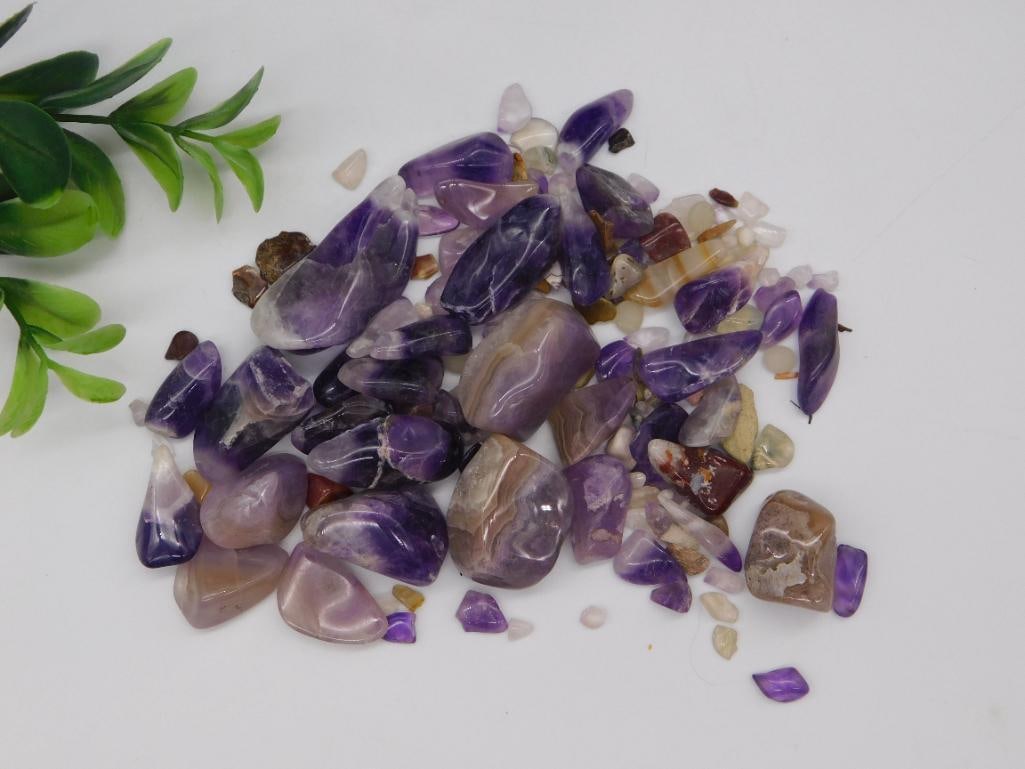 Tumbled Amethyst and Agate Crystal Lot: Approximately 100 grams of tumbled purple amethyst and banded agate stones in assorted sizes, polished smooth.