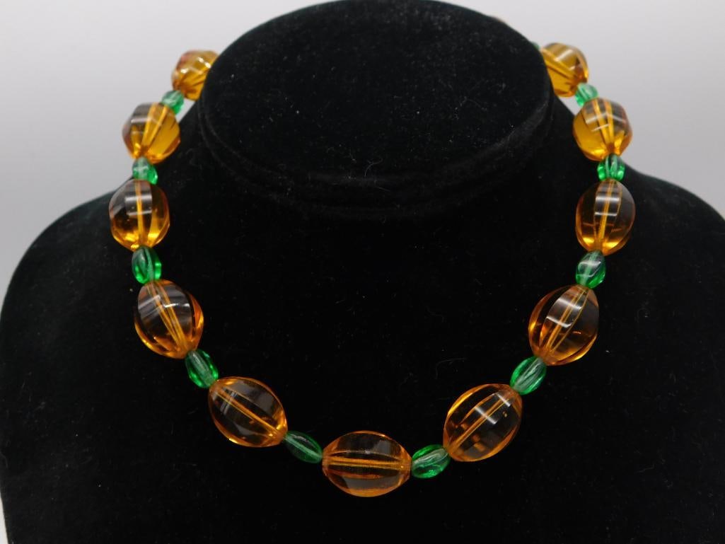 Amber & Green Glass Bead Necklace, Vintage Beaded Jewelry: Vintage necklace strung with alternating large oval amber-colored glass beads and small faceted green glass beads. Approximately 18-20 inches long.