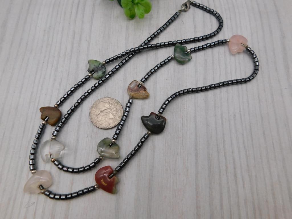 Hematite and Gemstone Heart Necklace: Beaded hematite necklace accented with polished heart-shaped agate and rose quartz stones.