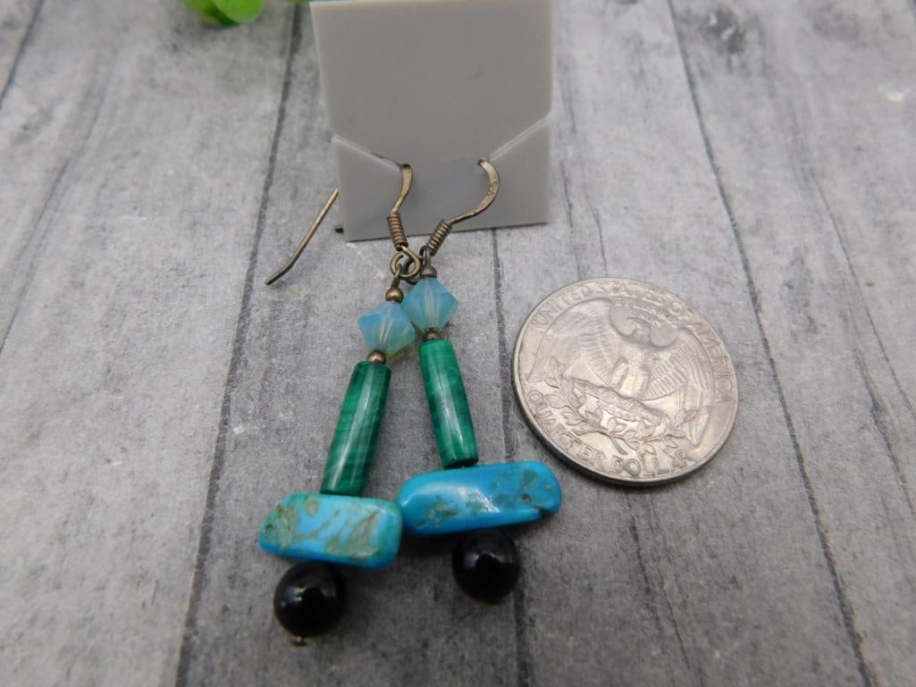 Turquoise and Malachite Dangle Earrings: Pair of beaded dangle earrings featuring turquoise nuggets, malachite tubes, and black onyx accents.