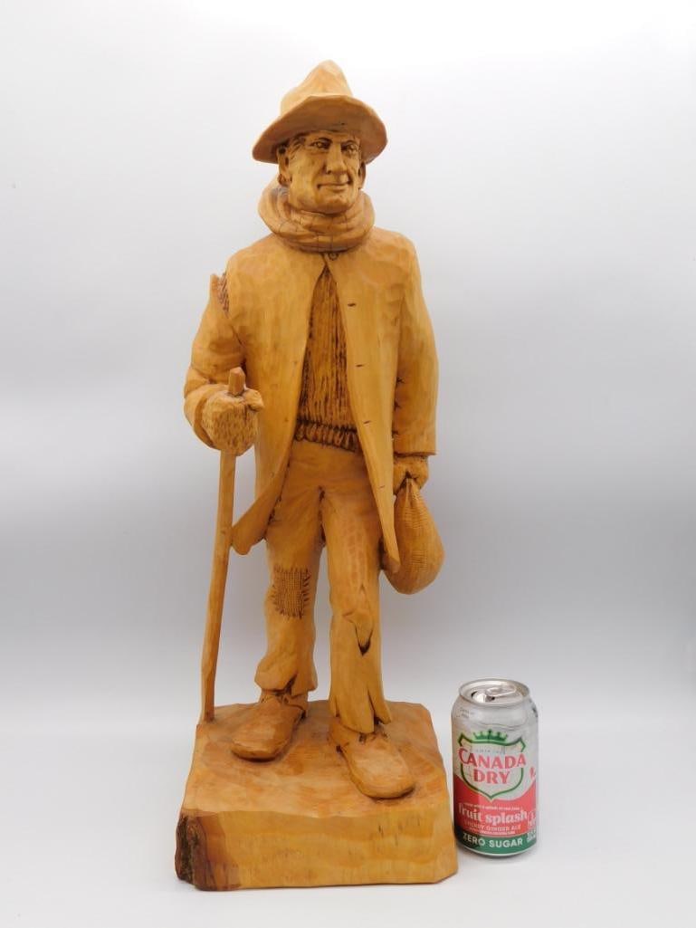Hand Carved Wood HOBO Figurine of Traveling Man R ROY: A detailed hand-carved wooden figurine of a bearded man wearing a hat and scarf carrying a cane and sack. Signed and dated R. Roy -04-; approximately 15 inches tall.