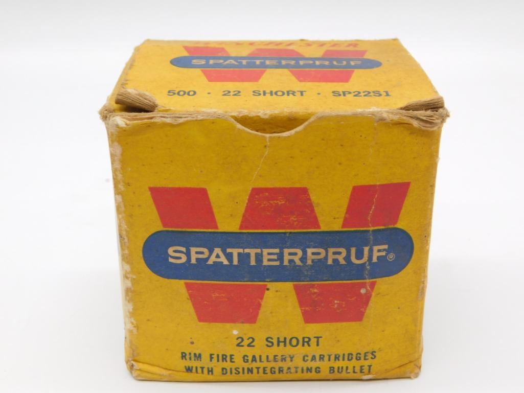 Vintage Winchester Spatterpruf Ammunition Box: A vintage yello...A vintage yellow cardboard box of Winchester-Western Spatterpruf .22 Short rimfire gallery cartridges (box of 500) showing wear and age.
