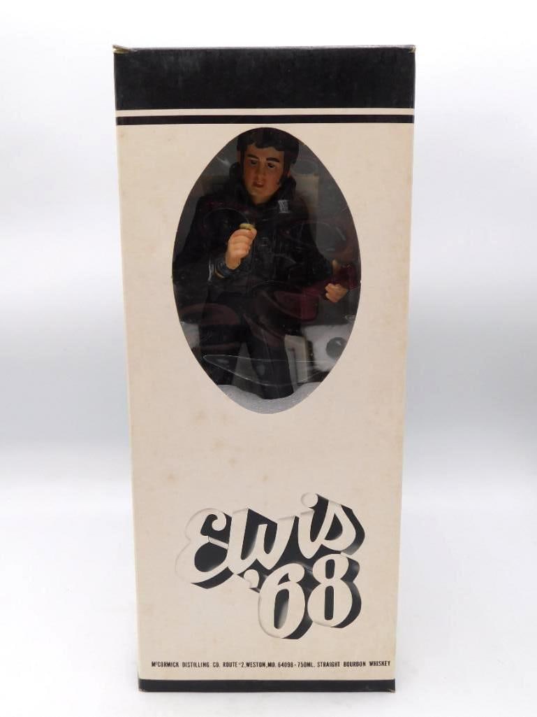 McCormick Forever Elvis '68 Comeback: A McCormick Distilling Co. decanter modeled as Elvis Presley in the black leather of the '68 Comeback, guitar in hand and microphone before him, the base lettered boldly ELVIS. Presented in the