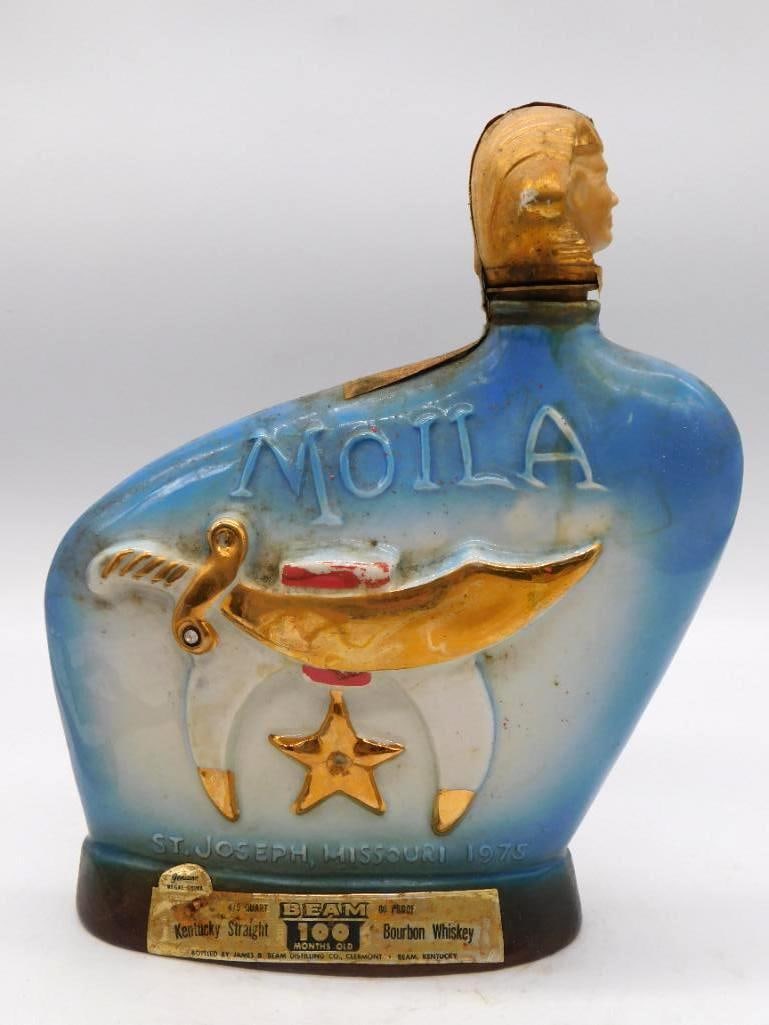 Jim Beam Moila Shriners Decanter, St.: A Jim Beam ceramic decanter struck for the Moila Shrine Temple of St. Joseph, Missouri, dated 1975, finished in blue and gold with a gold Shriner bust stopper and the crescent, star and scimitar. The