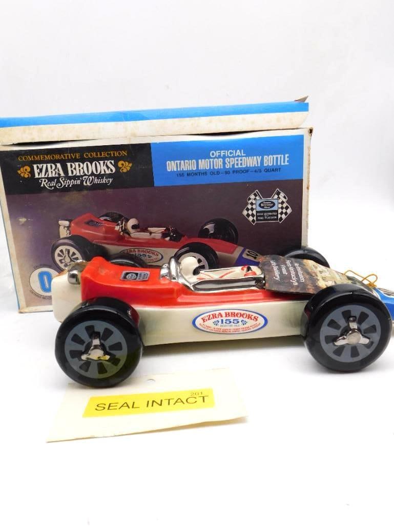 Ezra Brooks Ontario Motor Speedway Race: An Ezra Brooks decanter from the Commemorative Collection, modeled as the official Ontario Motor Speedway race car, number 10, in red and cream with chrome exhausts and black wheels. A spirited bit of