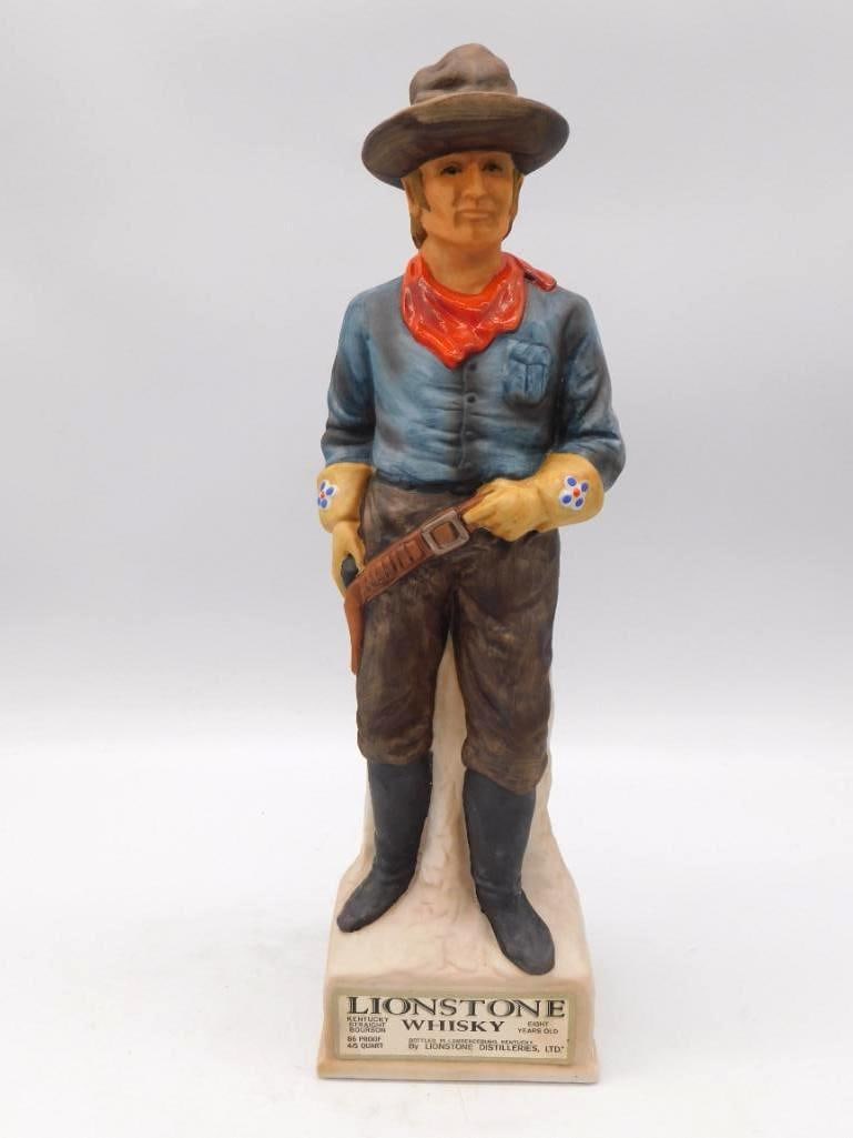Lionstone Whiskey Cavalry Scout Decanter: A Lionstone whiskey decanter modeled as a buckskin-clad U.S. Cavalry scout, rifle in hand, standing on a marbled rock-form base. An informational plaque tells of the civilian scouts who guided cavalry