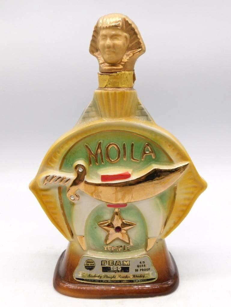 Lot of 2 Jim Beam Shriner Moila and: Two Jim Beam ceramic whiskey decanters on a Shriner theme: a Moila Temple piece with gold Shriner sword and star fez motif, and a companion Mecca Shrine decanter with matching gold turbaned finial