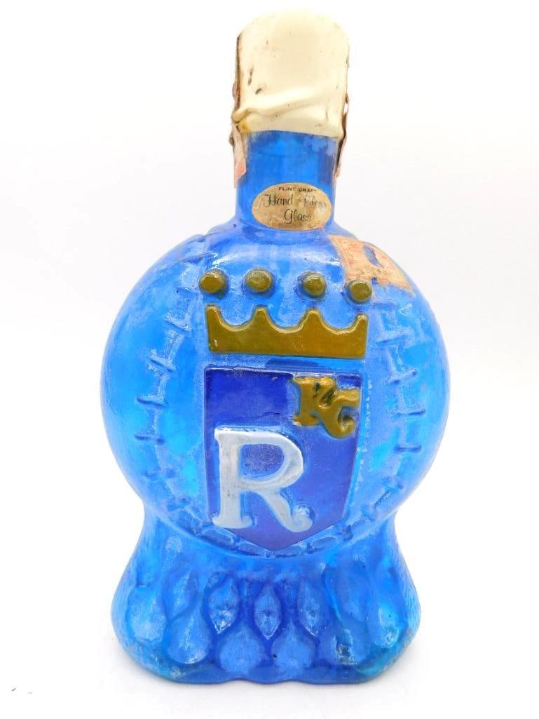 McCormick Kansas City Royals Comm. Blue: A handsome McCormick commemorative decanter in deep blue hand-blown glass, the face raised with a royal crown above a shield bearing the letter R for the Kansas City Royals. A Flint Craft Hand Blown