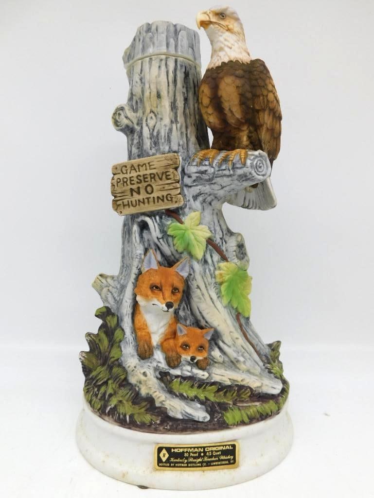 Hoffman Bald Eagle and Fox Game Preserve: A Hoffman Original Kentucky Straight Bourbon Whiskey decanter sculpted with a bald eagle perched upon a tree trunk, a fox and kit below beneath a Game Preserve No Hunting sign. The photo tag shows