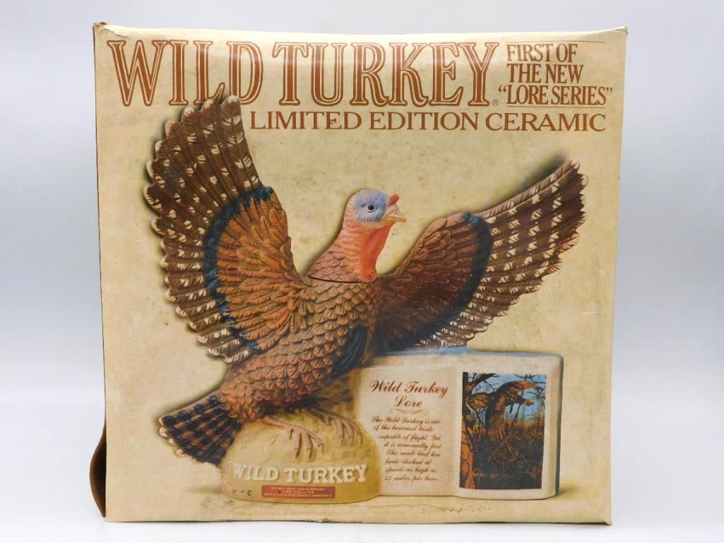 Wild Turkey Lore Series First Edition: An Austin Nichols Wild Turkey limited edition decanter, first of the Lore Series, showing a wild turkey in flight above a book lettered "Wild Turkey Lore." A capital subject for the sporting shelf.
