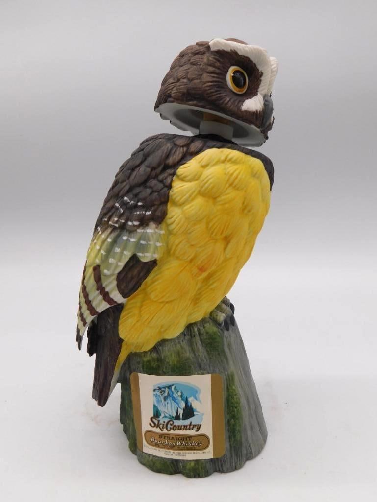 Ski Country Perched Owl Porcelain: A hand-painted porcelain Ski Country decanter in the form of a perched owl, the feather work rendered with a patient hand. Straight Bourbon Whiskey, and part of Ski Country's well-known wildlife