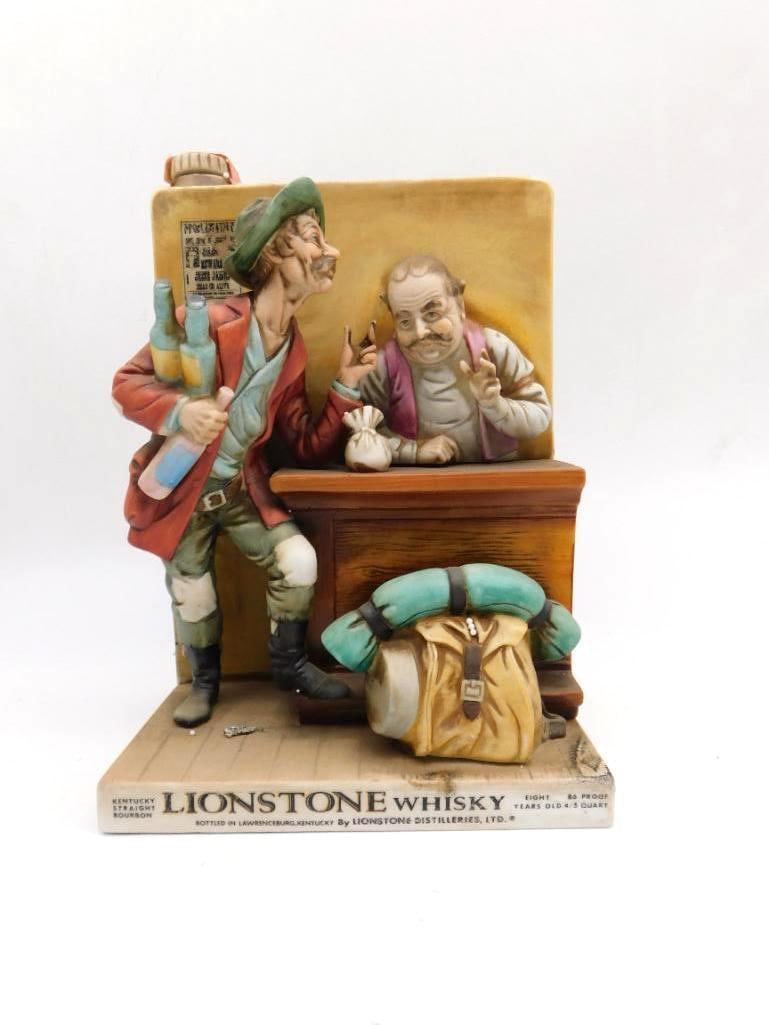 Lionstone Traveling Peddler Old West: A Lionstone Kentucky Straight Bourbon Whiskey decanter in porcelain, sculpted as a traveling salesman offering his bottles to a seated shopkeeper at the counter, his pack set down at his feet.