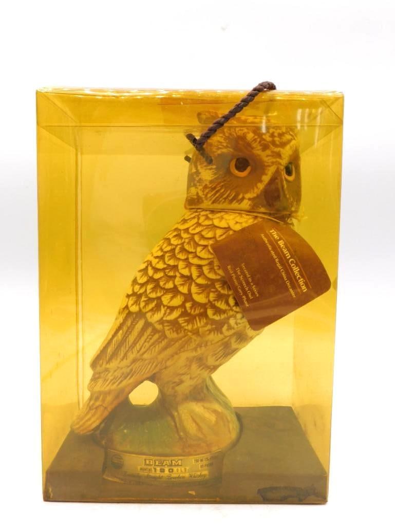 Jim Beam Regal China Owl Decanter and: A Jim Beam "The Beam Collection" Regal China decanter modeled as an owl in amber and tan tones, sober-eyed and well-turned. The original hang tag and clear display box accompany it. Approximately 10