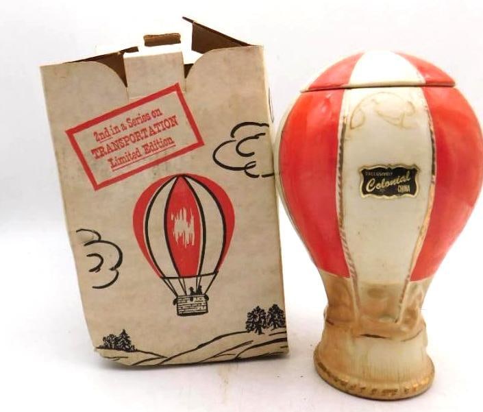 Colonial China Hot Air Balloon: A Colonial China decanter shaped as a red and white hot air balloon, the second in a Limited Edition Transportation series. It comes with its original illustrated box. There is light wear to the
