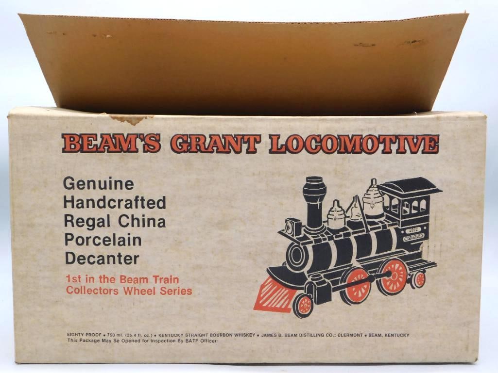 Jim Beam Grant Locomotive Regal China: A Jim Beam Regal China decanter cast as the Grant locomotive, first in the Beam Train Collectors Wheel Series. The black body is picked out in gold and red, and it comes in its original illustrated