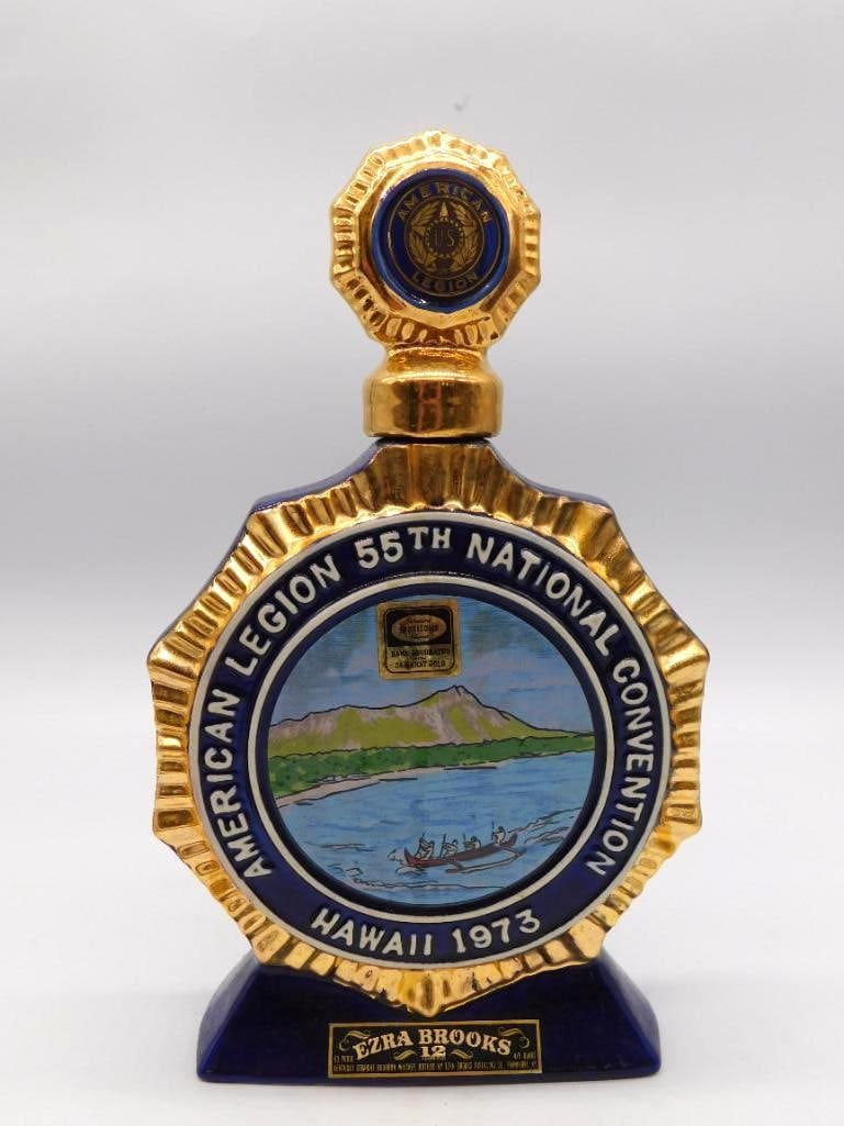 Ezra Brooks American Legion 55th Natl: An Ezra Brooks ceramic decanter in blue and gold octagonal form marking the American Legion 55th National Convention, Hawaii 1973, topped with a gold medallion stopper. The reverse carries a