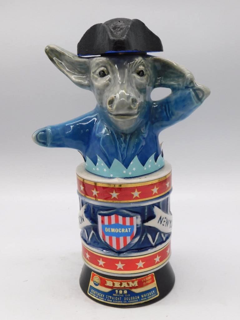 Jim Beam 1976 Bicentennial Democrat: A second Jim Beam 1976 Bicentennial Democrat donkey decanter, this one in a blue-gray color variation, the beast in a patriot hat astride a red, white and blue drum base marked "76." Ceramic,