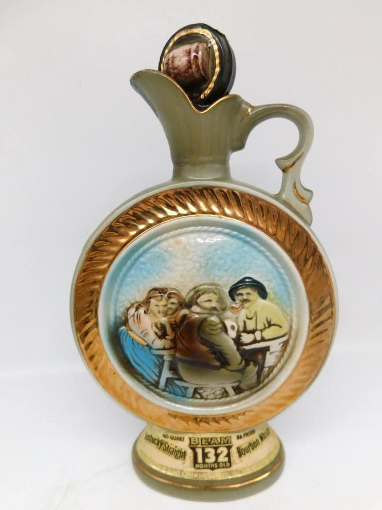 Jim Beam 132 Months Tavern Scene Ewer: A Jim Beam Regal China ewer-form decanter in a sage green glaze with gilt rope trim, the front medallion hand-painted with a tavern scene of three figures gathered at a barrel. Labeled 132 Months Old
