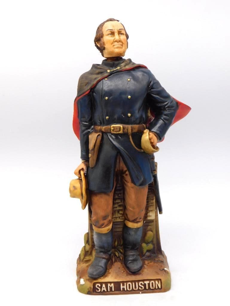 McCormick Sam Houston Decanter, Texas: A commanding McCormick decanter rendered as Sam Houston, caped and booted with hat in hand, standing at a split-rail fence. The sculptor caught an earnest, weather-set face, and the painting of the