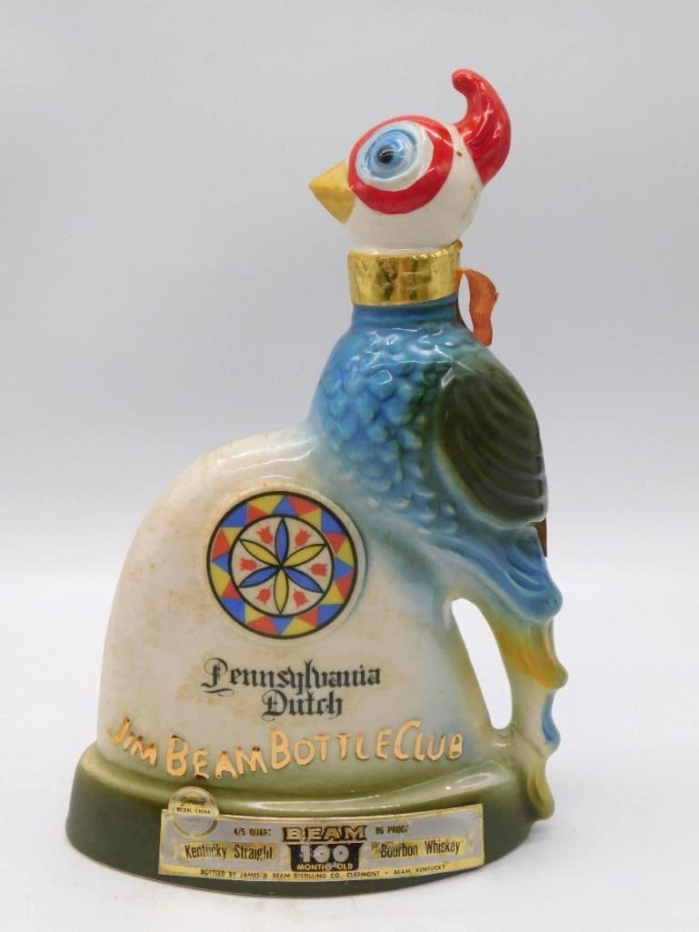Jim Beam Pennsylvania Dutch Bottle Club: A lively Regal China decanter modeled as a rooster in full color, its body bearing a hex-sign design and the Pennsylvania Dutch Jim Beam Bottle Club marking. Approximately 11 inches tall in the 4/5