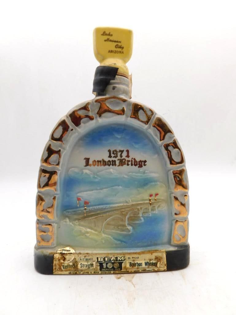 Jim Beam London Bridge 1971 Lake Havasu: A Jim Beam Regal China decanter marking the 1971 removal of London Bridge to Lake Havasu City, Arizona, with a painted bridge scene set beneath an arched, stone-textured frame. The original gold Beam