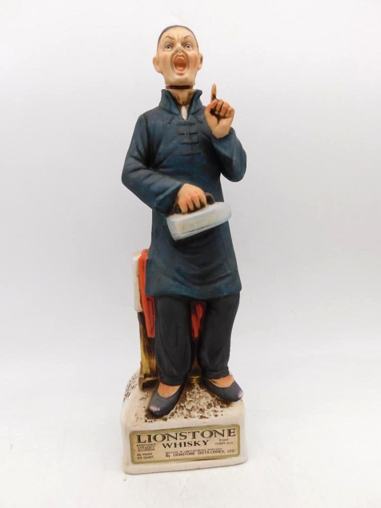 Lionstone Chinese Laundryman Old West: A Lionstone Old West decanter modeled as a Chinese laundryman, flatiron in hand and a finger raised in argument, the sculptor catching the moment with genuine humor. Approximately 12 inches tall;