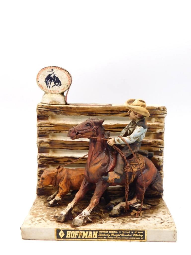 Hoffman Orig PRCA Calf Roping Rodeo: A spirited Hoffman Original decanter rendering a calf-roping run in the arena, the cowboy leaning from the saddle as horse and calf break past a rail fence. The modeling is lively and the paint work