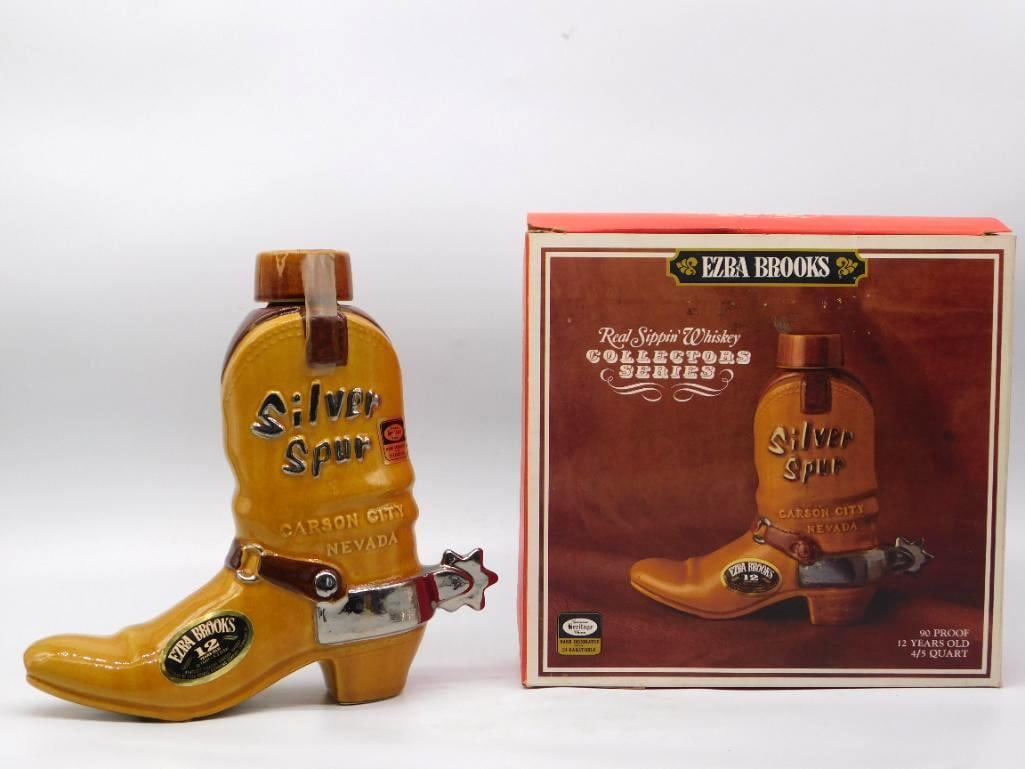 Ezra Brooks Silver Spur Carson City: A handsome Ezra Brooks bottle shaped as a cowboy boot lettered Silver Spur, Carson City, Nevada, its strap and rowel spur rendered in bright silver luster against a warm caramel glaze. Part of the