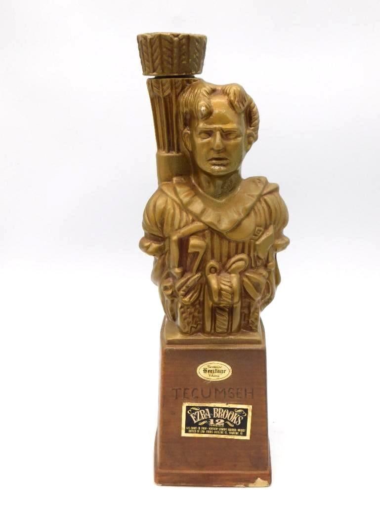 Ezra Brooks Tecumseh Bust Heritage China: A dignified Ezra Brooks Genuine Heritage China decanter cast as a bust of the Shawnee leader Tecumseh, glazed in brown and gold and standing approximately 11 inches tall. The base is marked Ezra Brook