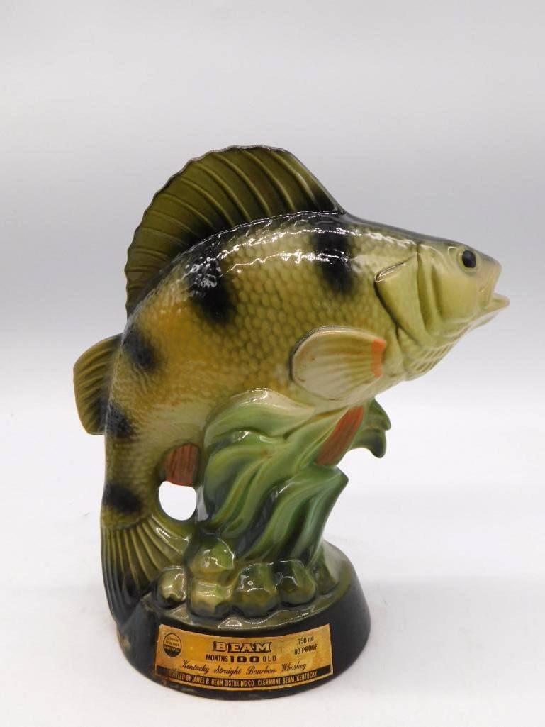 Jim Beam Largemouth Bass Fresh Water: A Jim Beam decanter modeled as a largemouth bass, marked for the National Fresh Water Fishing Hall of Fame at Hayward, Wisconsin. Straight Bourbon Whiskey, 80 proof. Runs approximately 10.5 inches