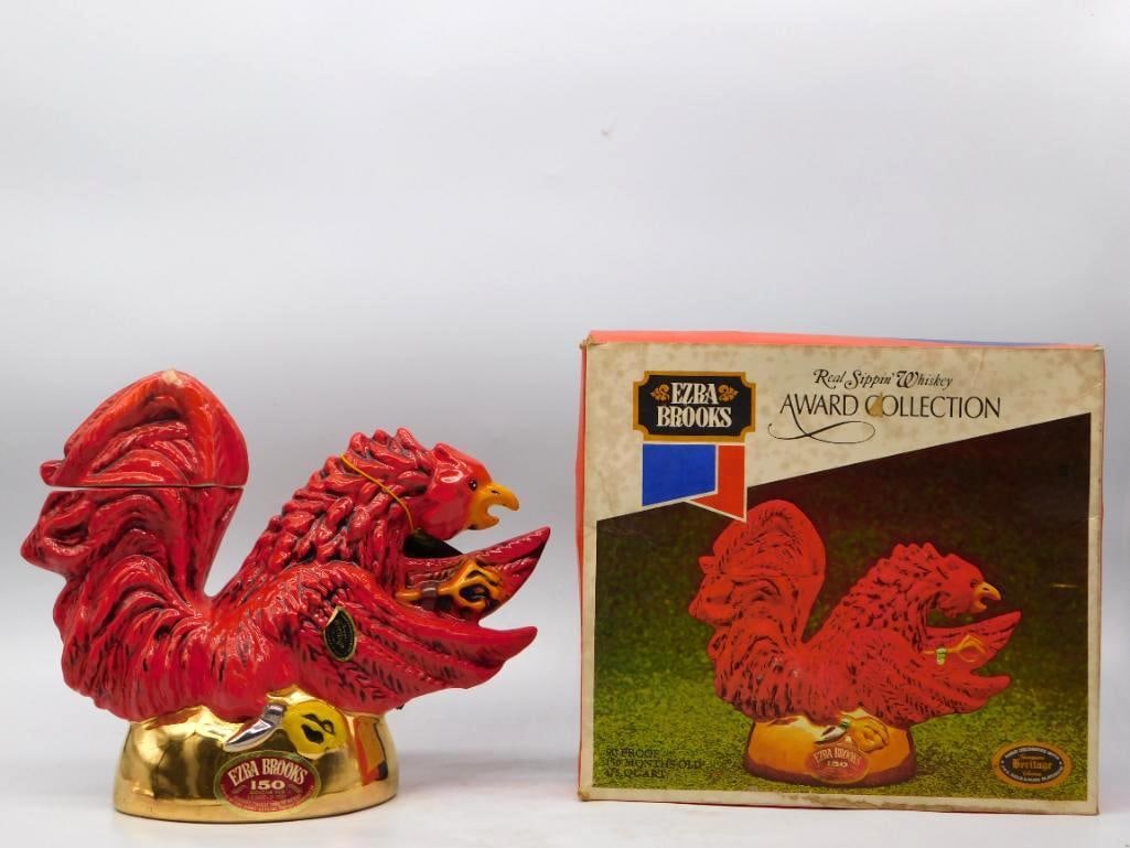 Ezra Brooks Award Collection Red Rooster: An Ezra Brooks Heritage China decanter from the Award Collection, modeled as a red rooster with head thrown back and wings spread wide. The mold-maker's work is bold and the scarlet glaze uncommonly d