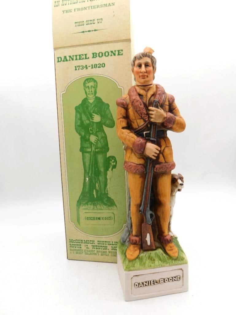 McCormick Daniel Boone Frontiersman: A McCormick Distilling porcelain decanter modeled as Daniel Boone with his hunting dog at heel, the base marked Daniel Boone. Comes complete with the original Frontiersman series shipping box. Good