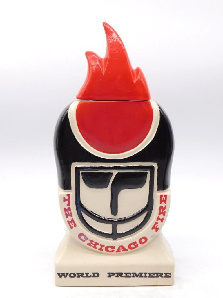 The Chicago Fire 1974 World Football: A lively decanter made for the Chicago Fire of the World Football League, the body shaped as a helmeted head with the club's flame device rising as the stopper. The front is lettered THE CHICAGO FIRE 