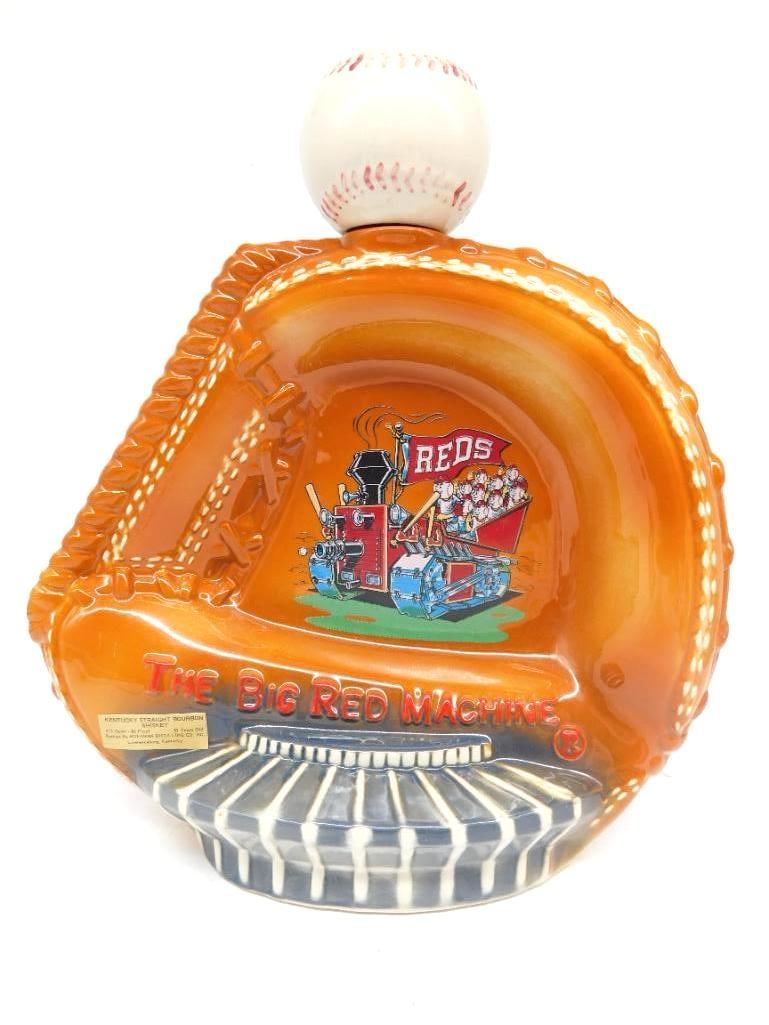 Jim Beam Cincinnati Reds Big Red Machine: A Jim Beam Regal China decanter shaped as a baseball mitt with a baseball-form stopper, decorated with the Cincinnati Reds Big Red Machine emblem and the Mr. Redlegs mascot. Approximately 9 inches tal