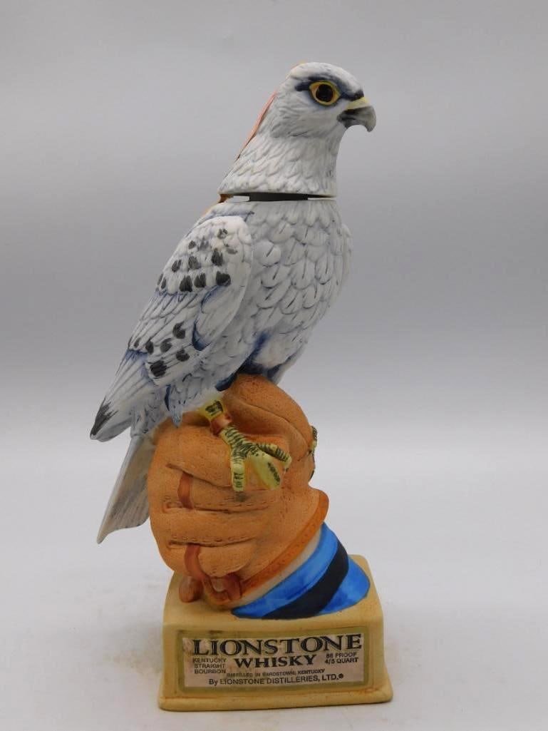 Lionstone The Peregrine Falcon Kentucky: A Lionstone Kentucky Straight Bourbon Whiskey decanter modeled as The Peregrine Falcon perched upon a gloved hand, with a descriptive plaque set into the base. A spirited piece of sculpture and a