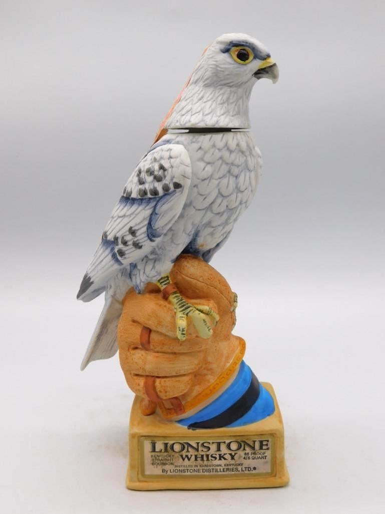 Lionstone Peregrine Falcon Ceramic: A Lionstone decanter modeled as a peregrine falcon perched upon a gloved hand, a descriptive plaque set into the base. The sculptor caught the bird's commanding stance, and the painter gave the feathe