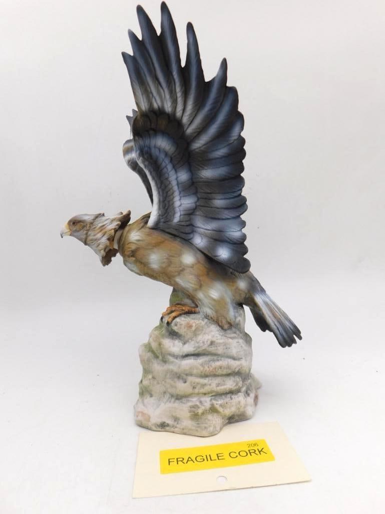 Bald Eagle Wings Spread Porcelain: A hand-painted porcelain decanter sculpted as a bald eagle with wings fully spread, perched upon a rocky base. A commanding bird, and no small feat of the mold-maker's art. Marked with a "Fragile Cork