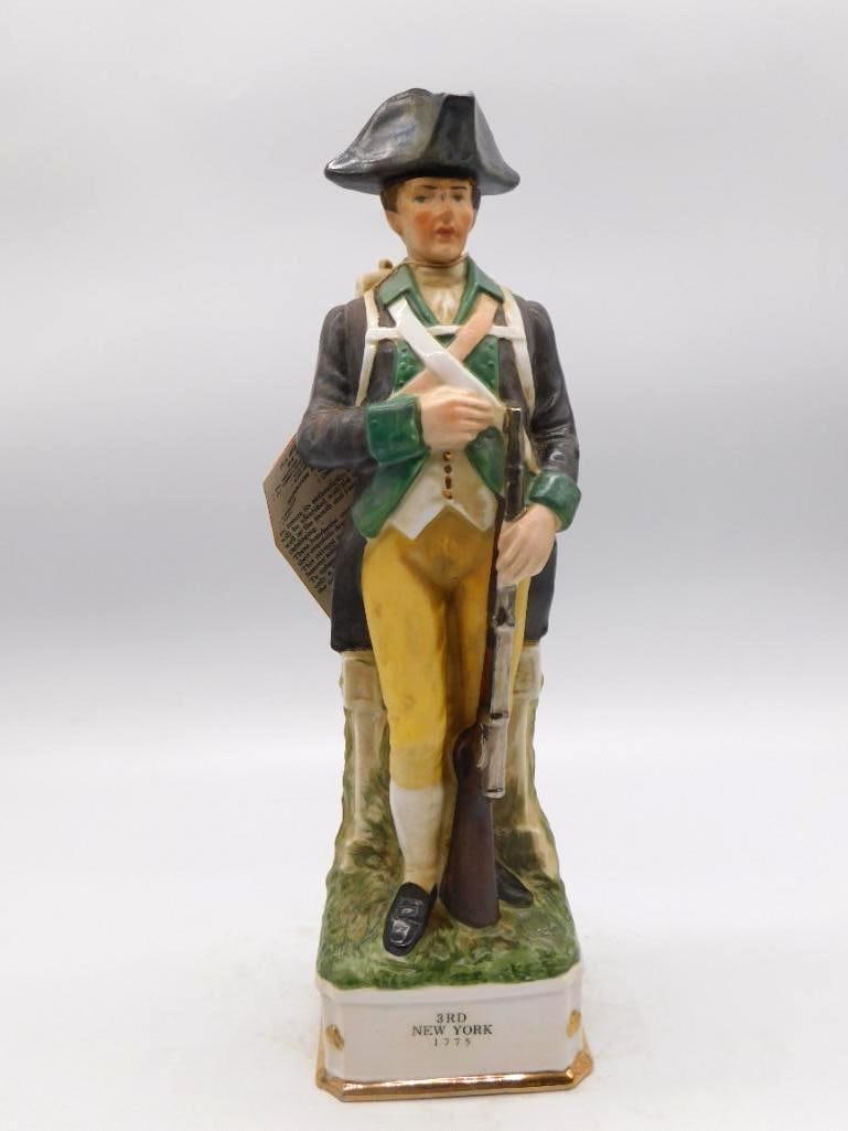 Grenadier Spirits 3rd New York Regiment: A hand-painted porcelain decanter from The Grenadier Spirits Co., modeled as a Revolutionary War soldier of the 3rd New York, 1775. The uniform is rendered with a shrewd eye, and the original