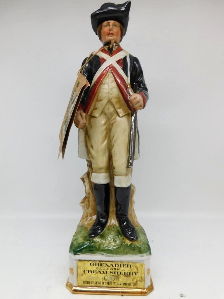 Grenadier California Cream Sherry: A Grenadier Spirits Co. porcelain decanter, issued by Arnart Imports in June of 1969, portraying a Continental Army soldier in tricorn hat with musket shouldered. The original hangtag is still present