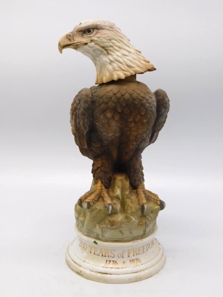 Bald Eagle 200 Years of Freedom: A commanding ceramic decanter modeled as a bald eagle at rest upon a rocky crag, the white head and hooked beak forming the stopper. The mold-maker gave every feather its own edge, and the painter