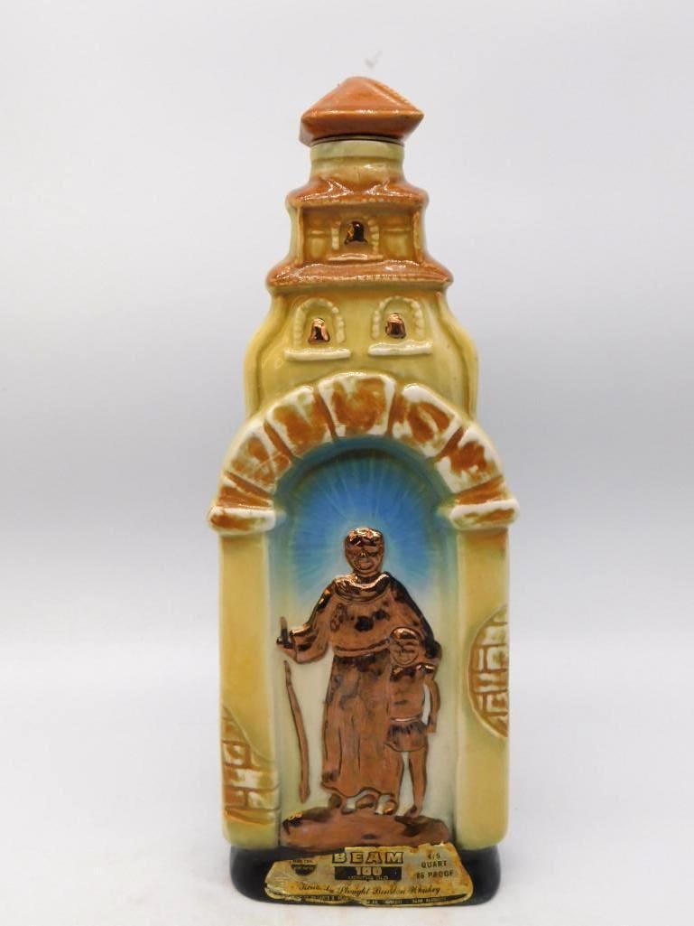 Jim Beam 200th Anniv. of California's: A Jim Beam decanter shaped as a Spanish mission bell tower, the friar and his young charge modeled in relief beneath the arch and finished in copper luster. The raised lettering for the 200th
