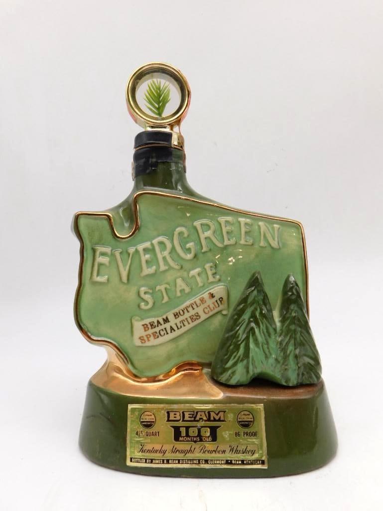 Jim Beam Evergreen State Washington: A Jim Beam Regal China decanter cut to the silhouette of Washington state in a green glaze, reading Evergreen State, Beam Bottle & Specialties Club, with molded evergreens across the face. A pine