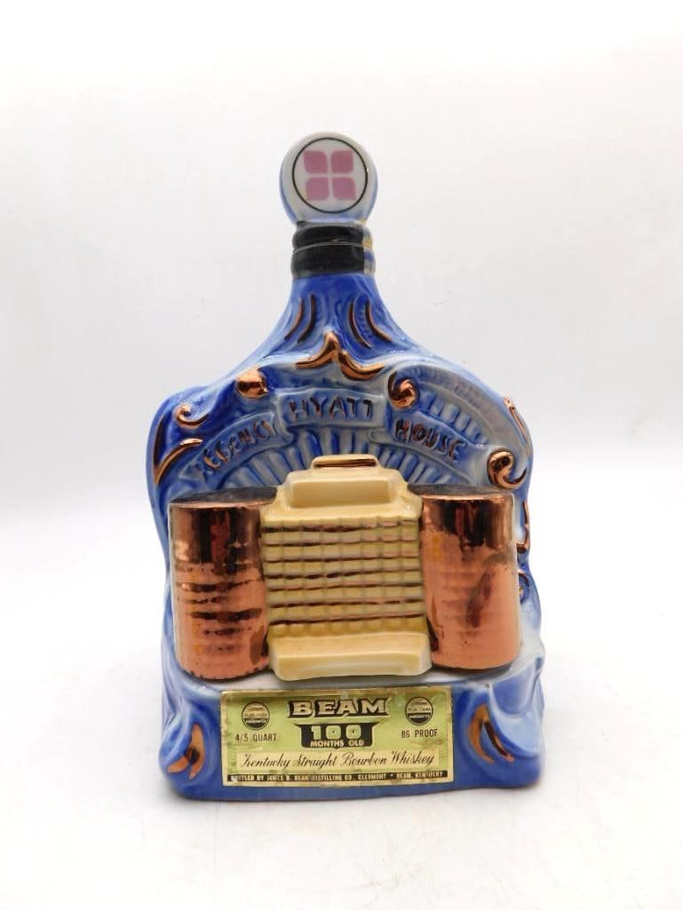 Jim Beam Regency Hyatt House Decanter in: A second Jim Beam Regal China Regency Hyatt House decanter, matching the blue and copper-tone design and retaining its original gold neck label. Offered as a companion to the first. Good vintage condi