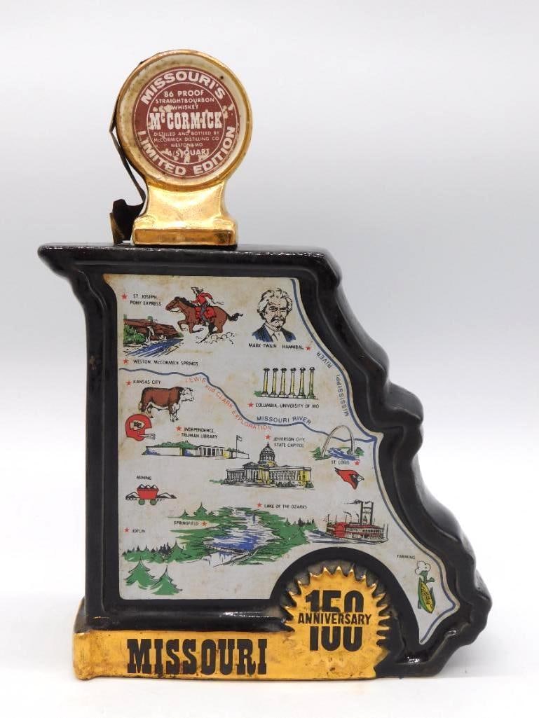 McCormick Missouri 150th Anniv. Ltd Ed: A McCormick Distilling limited edition decanter marking Missouri's 150th Anniversary, cast in a black and gold plaque form and illustrated with state landmarks: the capitol, Mark Twain, the Pony