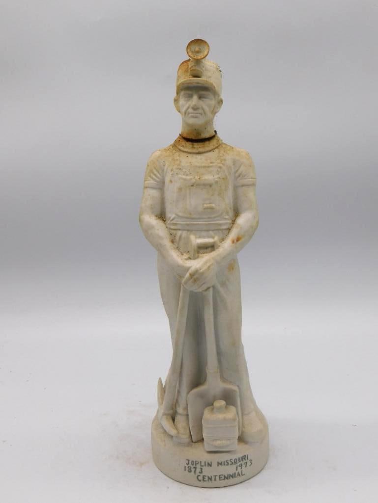 McCormick Joplin Missouri Centennial: A McCormick ceramic decanter marking the centennial of Joplin, Missouri, 1873 to 1973, finished in an off-white glaze with the motto "Growing into Tomorrow, Out of Yesterday" upon the base.