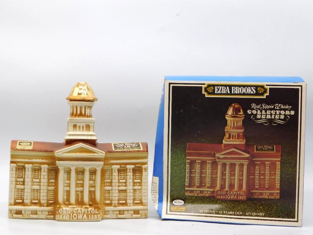 Ezra Brooks Old Capitol Iowa 1840-1857: An Ezra Brooks Collectors Series decanter modeled as the Old Capitol of Iowa, its gilded dome and long colonnade rendered with a shrewd eye for the mold-maker's art. Warm caramel and cream glazes