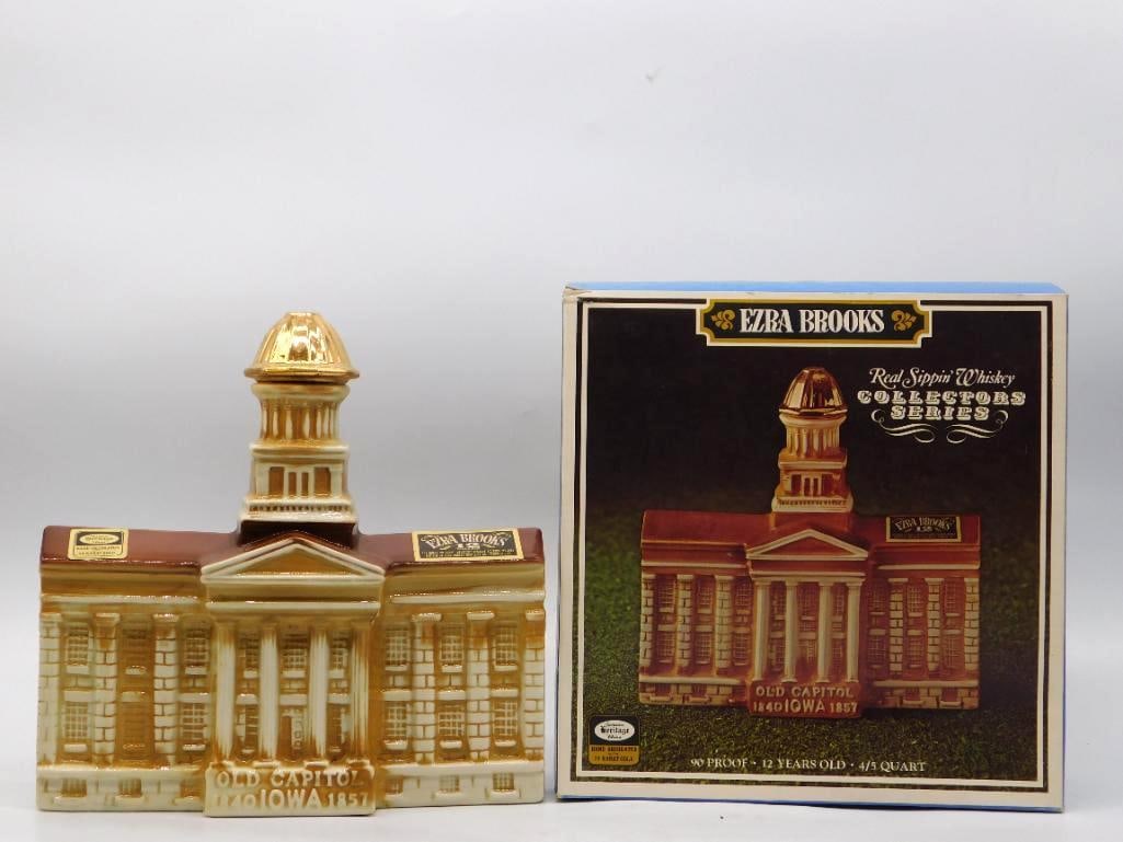 Ezra Brooks Old Capitol Iowa 1840-1857: A handsome Ezra Brooks Collectors Series decanter modeled as the Old Capitol at Iowa City, its colonnade and gold-domed cupola rendered with a shrewd eye for architecture. The honey-brown glaze has