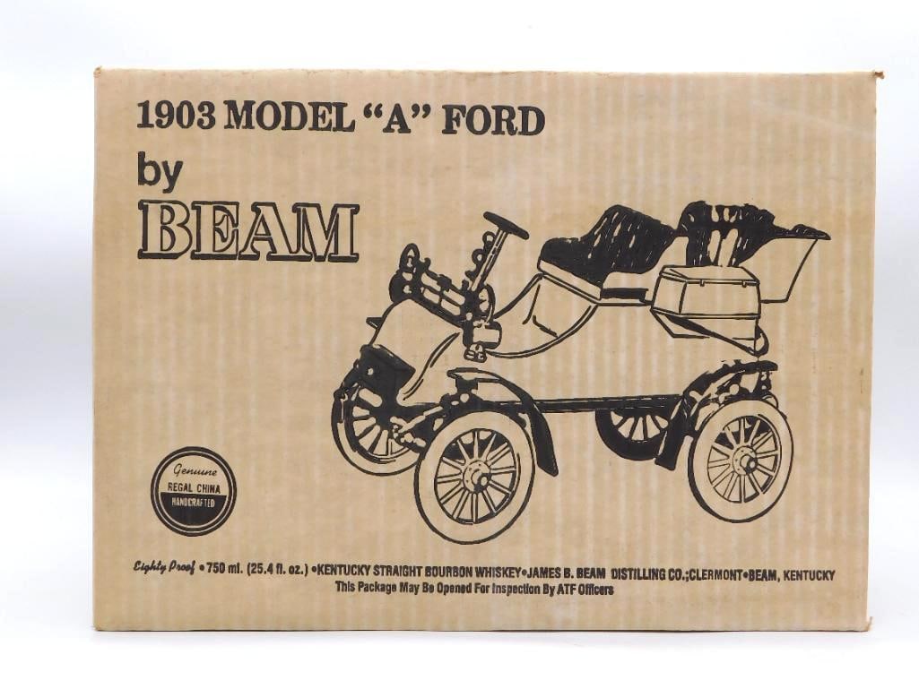 Jim Beam 1903 Model A Ford Regal China: A handsome Jim Beam Regal China decanter modeled after a 1903 Model A Ford touring car, finished in glossy black with gold-tone hardware, red upholstered seats, and whitewall tires. Approximately 12
