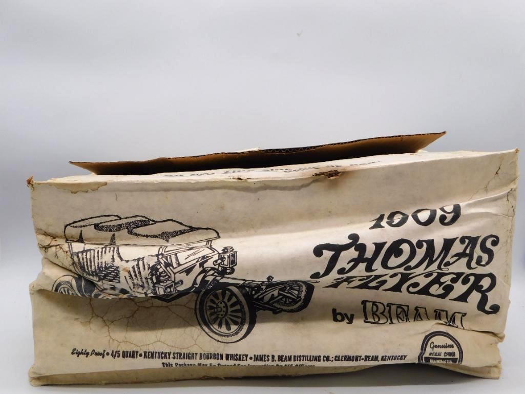 Jim Beam 1909 Thomas Flyer Regal China: A Jim Beam Regal China decanter modeled after the 1909 Thomas Flyer touring automobile, marked Kentucky Straight Bourbon Whiskey. A capital automotive subject for the collector who does not mind a